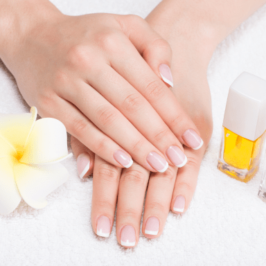 bd811a50 woman nail salon receiving manicure by beautician beauty treatment concept 1 min.png